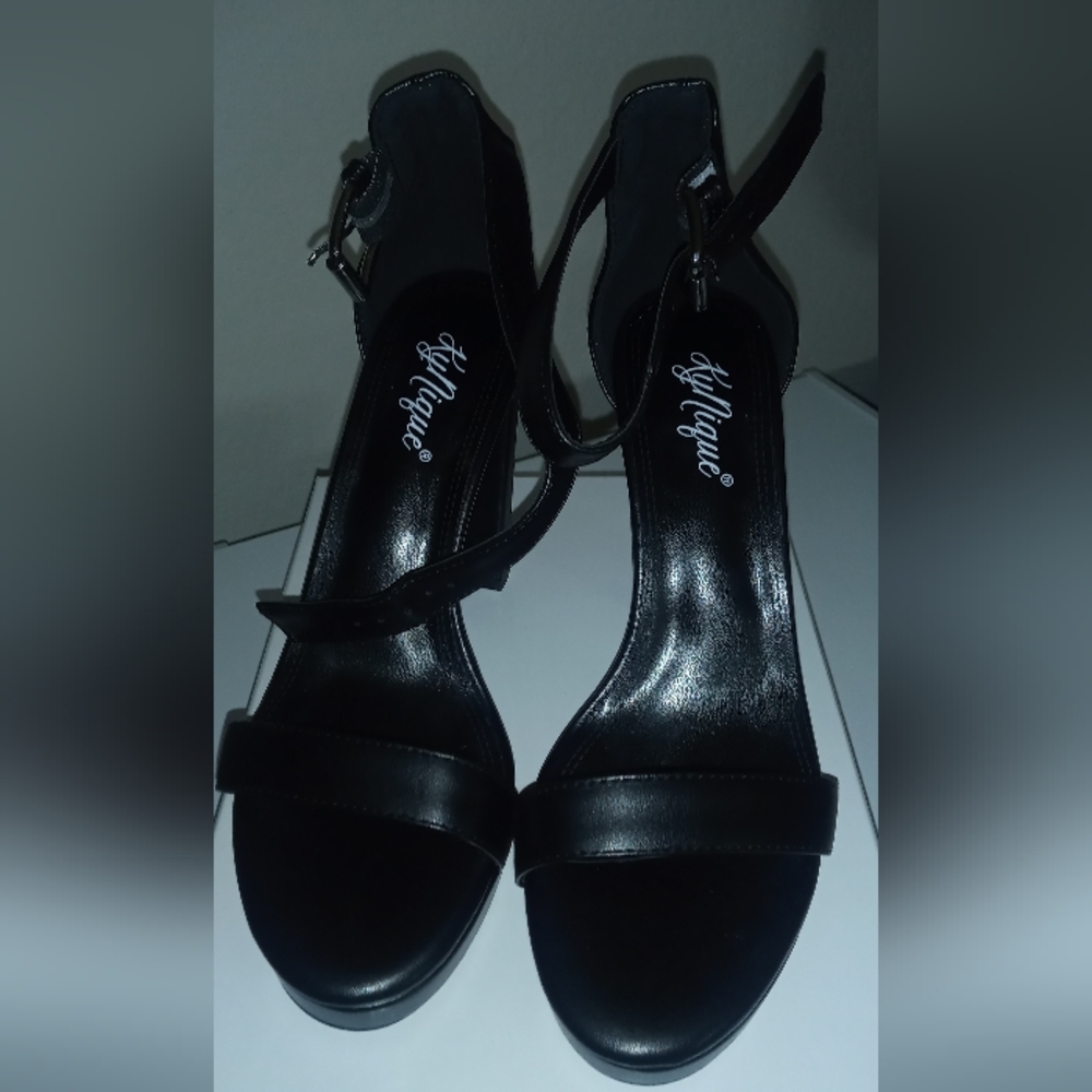 Brand new black leather platform heel.  KyNique, 8 - 11.